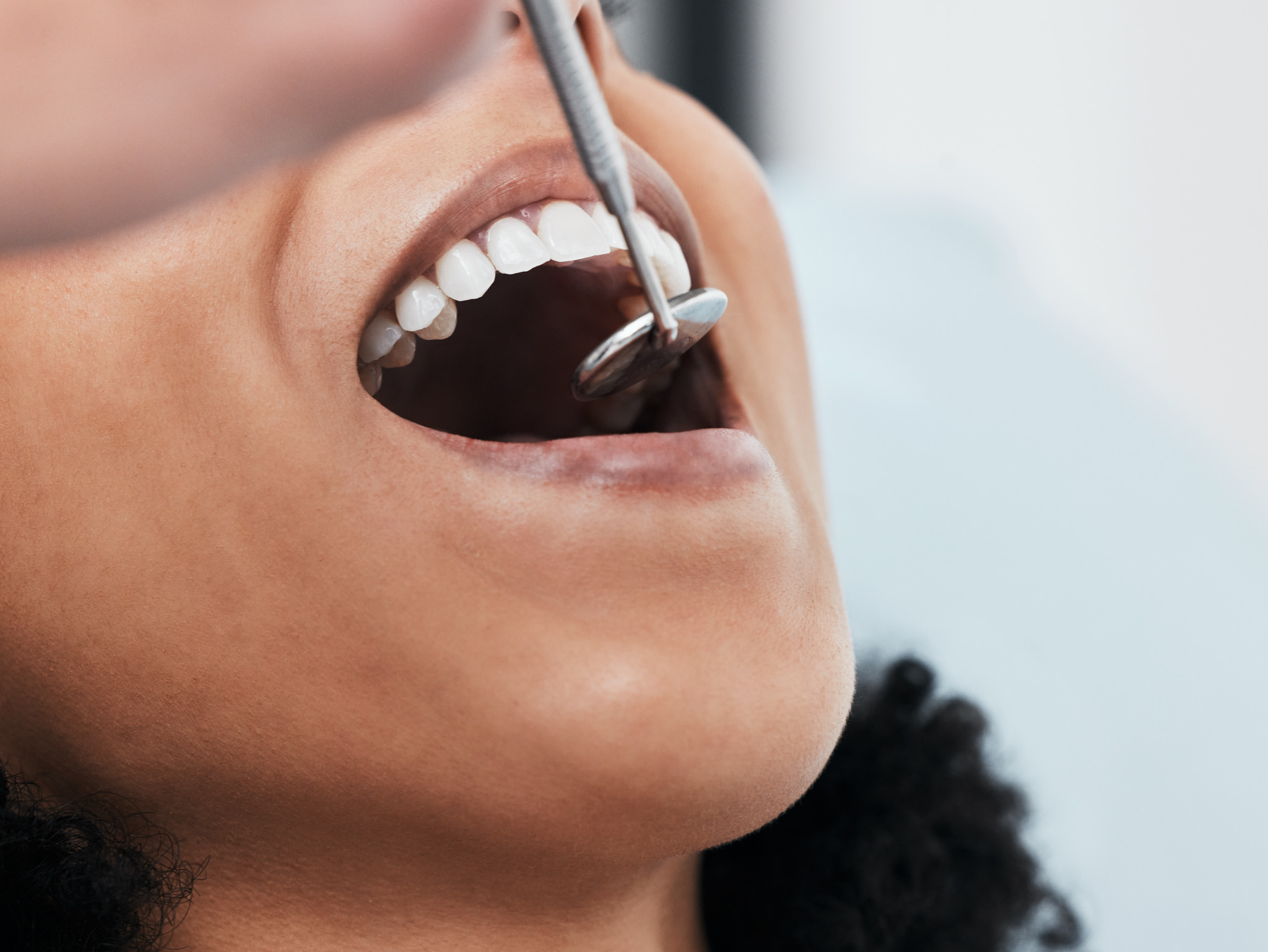 Mouth, teeth of woman and dentist with tools for dental cosmetic